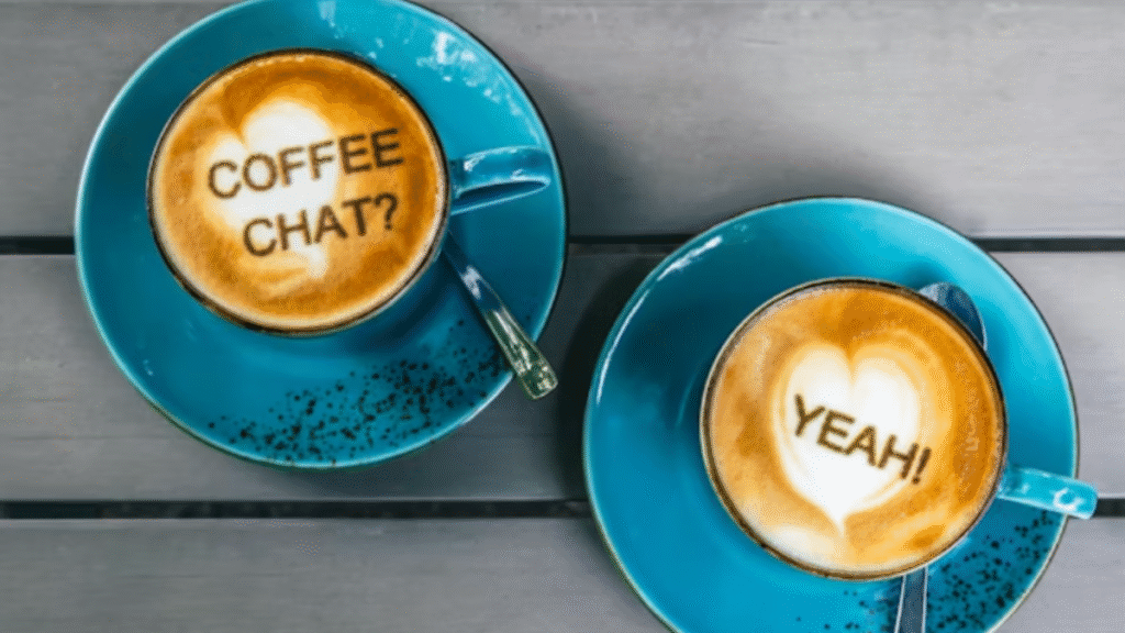 two latte-filled coffee cups side by side on a table, representing ongoing connection and donor engagement after an event