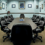 Nonprofit boardroom with meeting table and chairs representing governance and board leadership roles