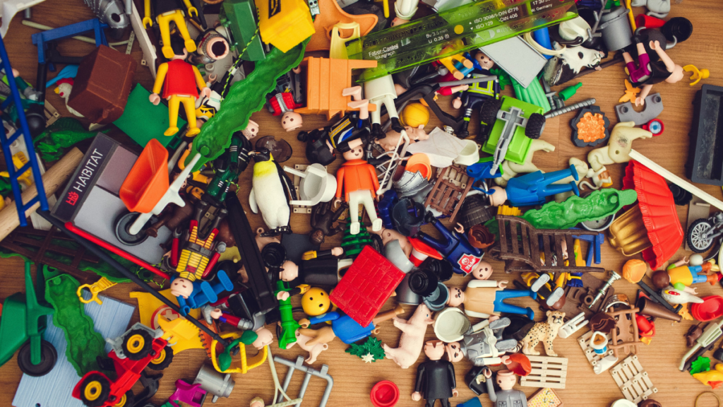 Small building blocks spread across the floor, representing the need to organize systems for scalability.