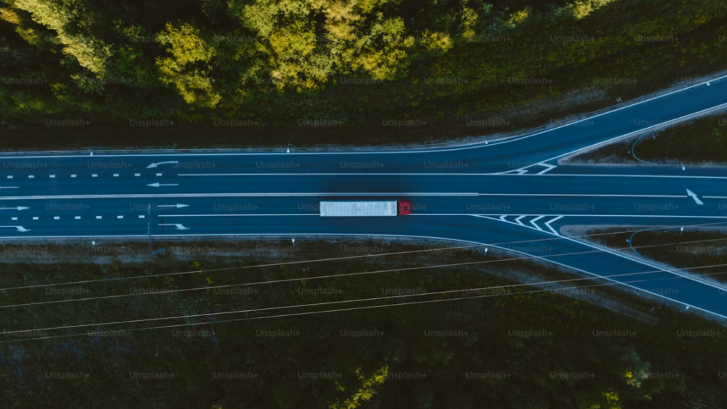 Overhead view of a highway splitting into three separate roads