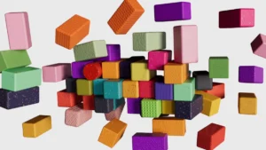 Wooden blocks in assorted sizes and colors arranged together representing the variety of innovative fundraising tactics for nonprofits